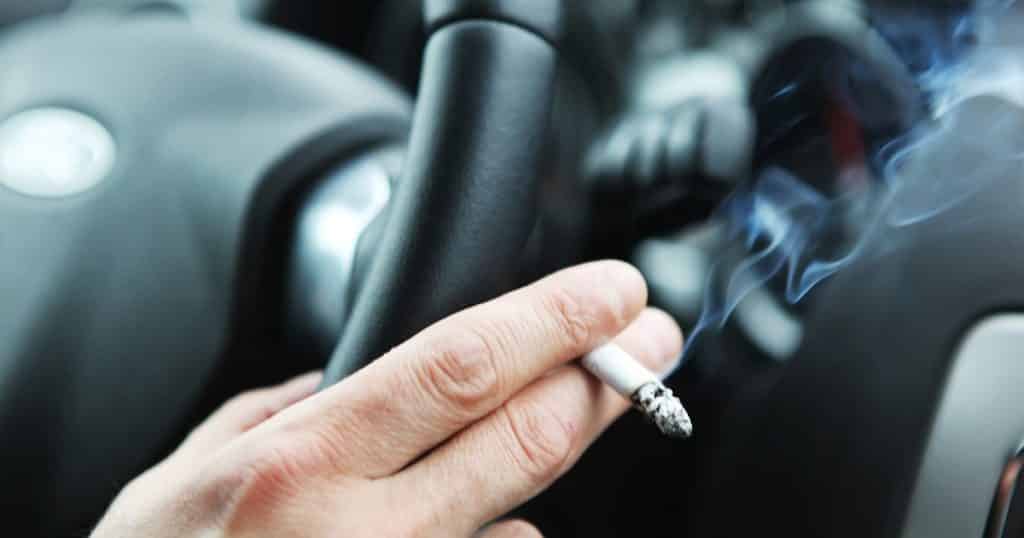 men smoking in car istock - Radio Samoa