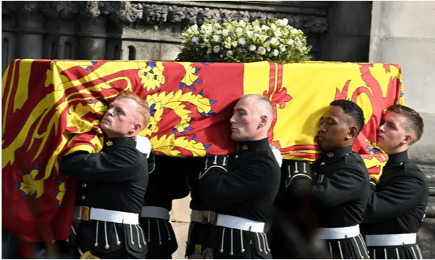 The coffin of Queen Elizabeth II is carried into St Giles Cathedral