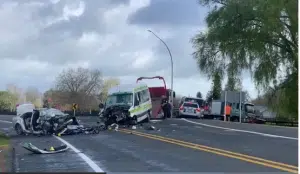 Two people have died following a collision between a car and an ambulance in Cambridge