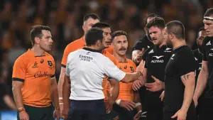 Nic White and Bernard Foley attempt to talk to referee Mathieu Raynal.