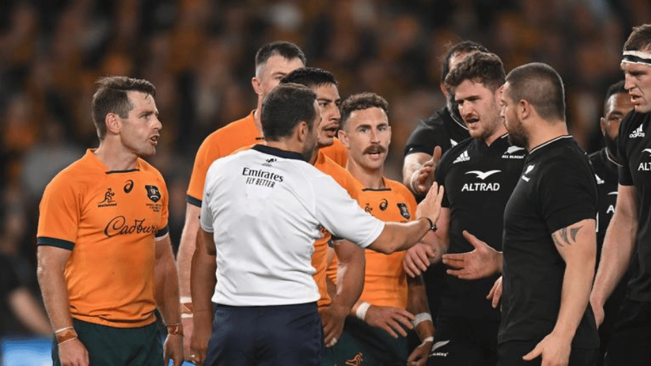 Nic White and Bernard Foley attempt to talk to referee Mathieu Raynal.