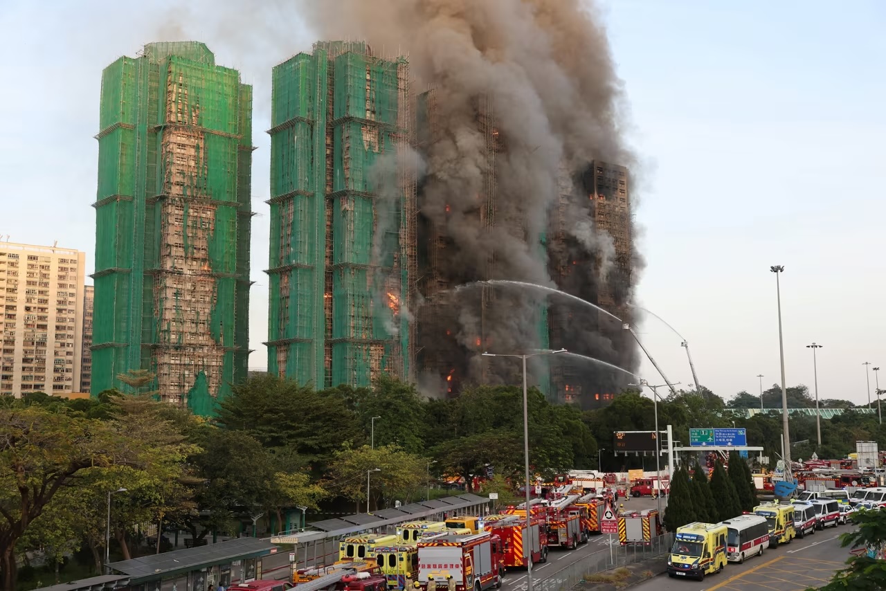 Efforts are underway to extinguish flames engulfing bamboo scaffolding across multiple buildings at the Wang Fuk Court housing estate in Hong Kong on November 26
