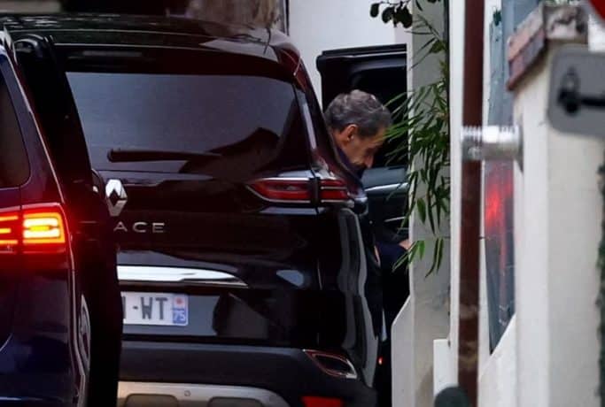miri2 Former French President Nicolas Sarkozy arrives at his house after a Paris court granted him an early release from jail in Paris, France, on Monday