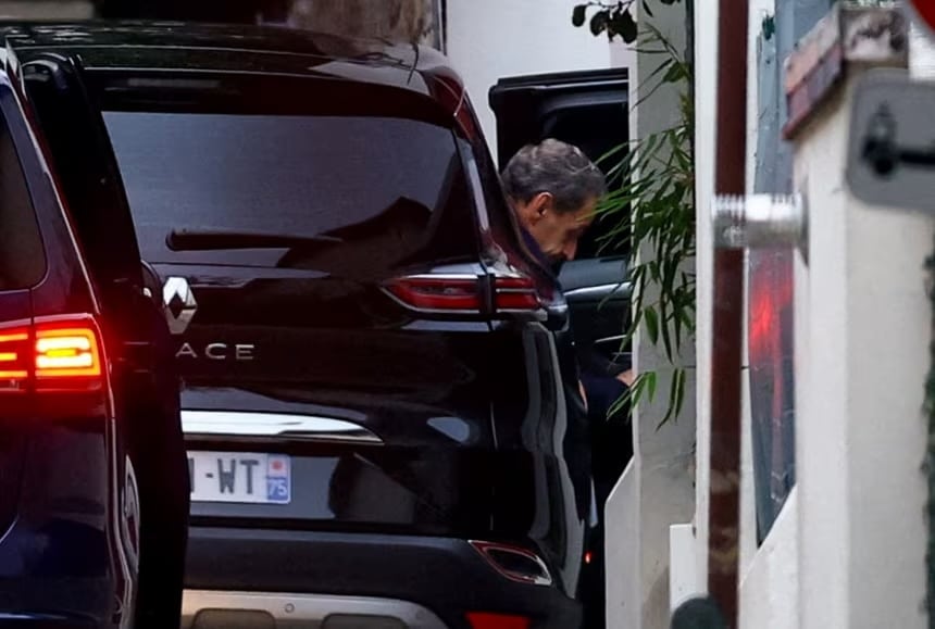 miri2 Former French President Nicolas Sarkozy arrives at his house after a Paris court granted him an early release from jail in Paris, France, on Monday