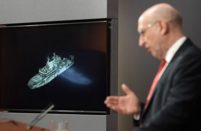 British Defense Secretary John Healey speaks in Downing Street on Wednesday, next to a screen showing the Yantar, a Russian spy ship