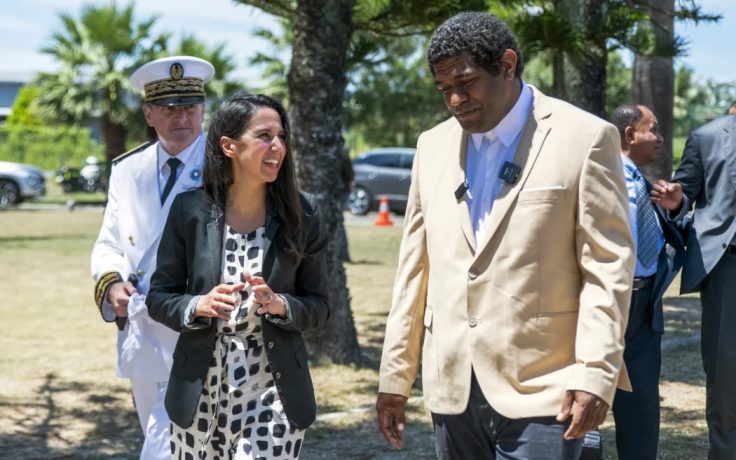 France's Minister for Overseas Naima Moutchou (left) is welcomed by the Customary Senate President Ludovic Boula (right) in Noumea
