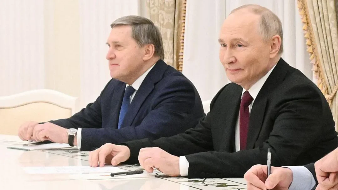 President Putin and his foreign policy aide Yury Ushakov.