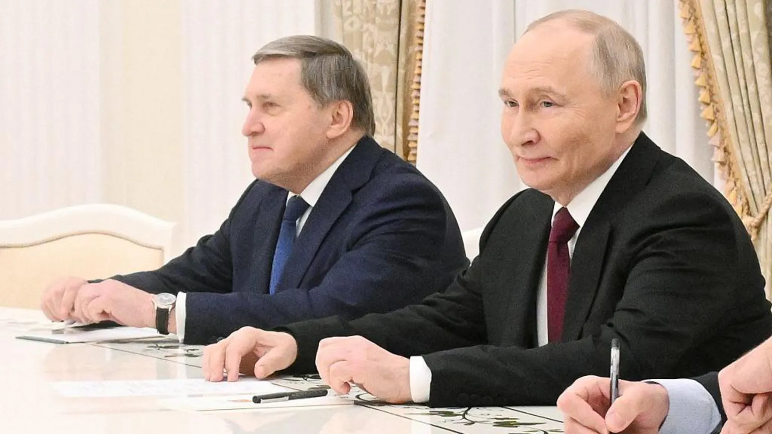 President Putin and his foreign policy aide Yury Ushakov.