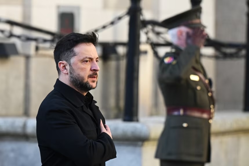 Ukrainian President Volodymyr Zelensky is welcomed by a military guard as he arrives for a meeting with Irish Prime Minister Micheal Martin, on December 2, 2025, in Dublin.