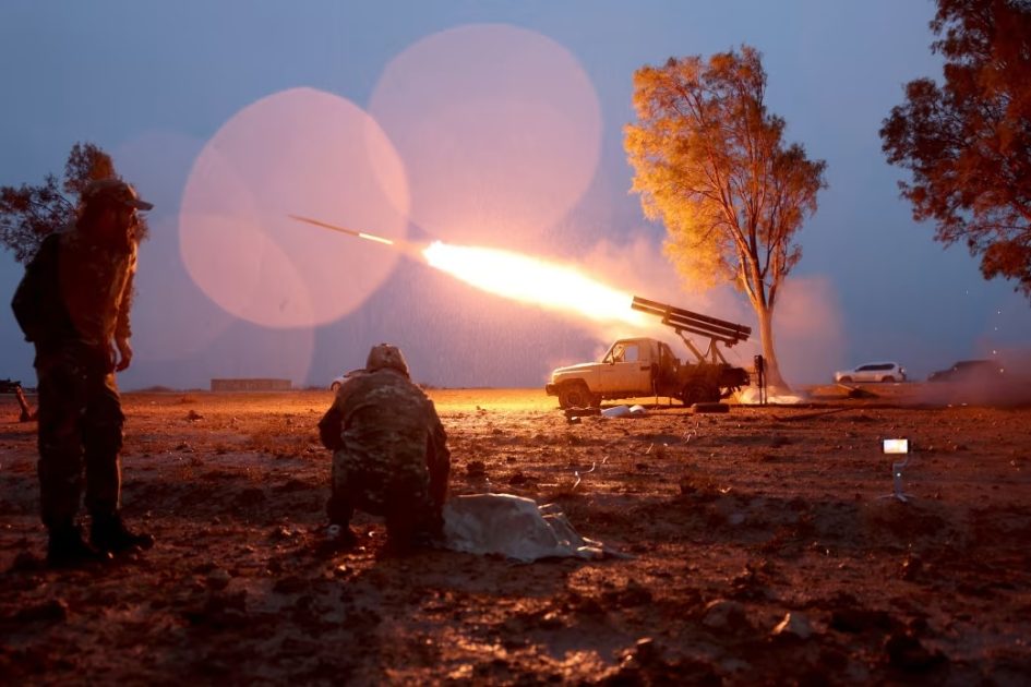Syrian government forces launch a rocket towards Kurdish forces near Dibsi Faraj, in the northern al-Tabqa area, Raqqa province, on January 17, 2026.