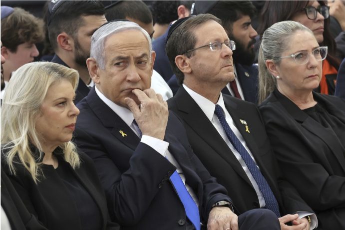 Israeli Prime Minister Benjamin Netanyahu (left) sits with President Isaac Herzog, who will visit Australia next month.