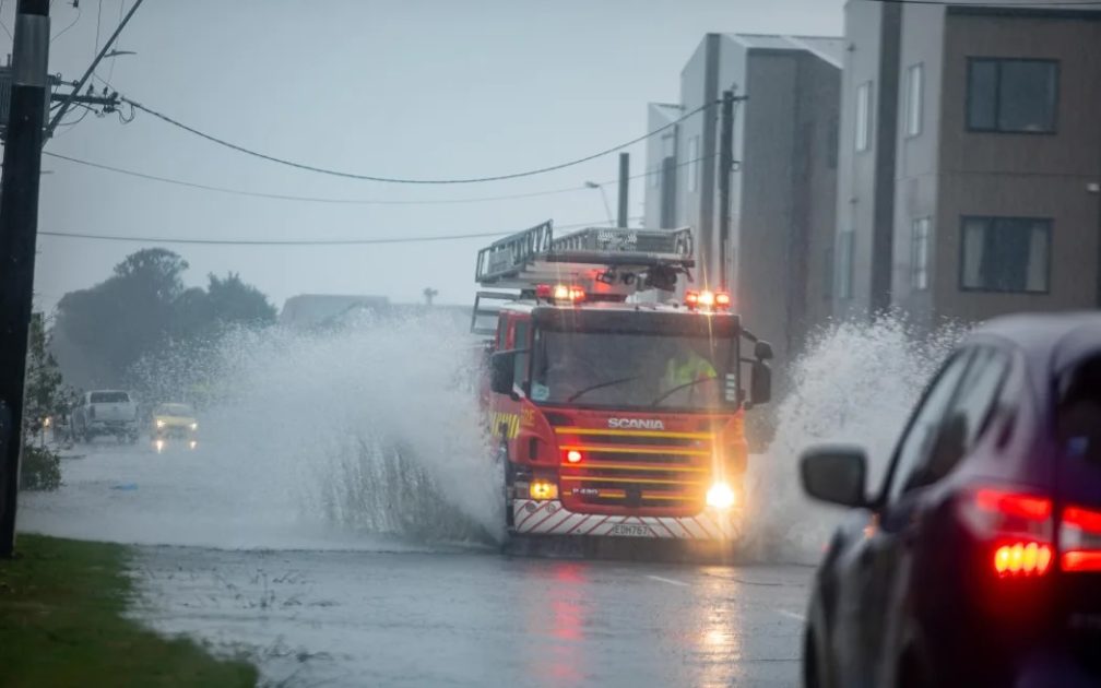 Emergency vehicles making their way through flooded roads in Wellington on 16 February 2026.