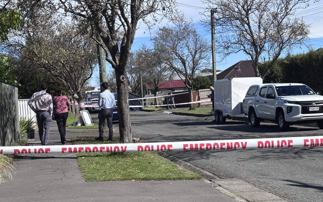 Police officers at the scene in the Christchurch suburb of Northcote on Thursday.
