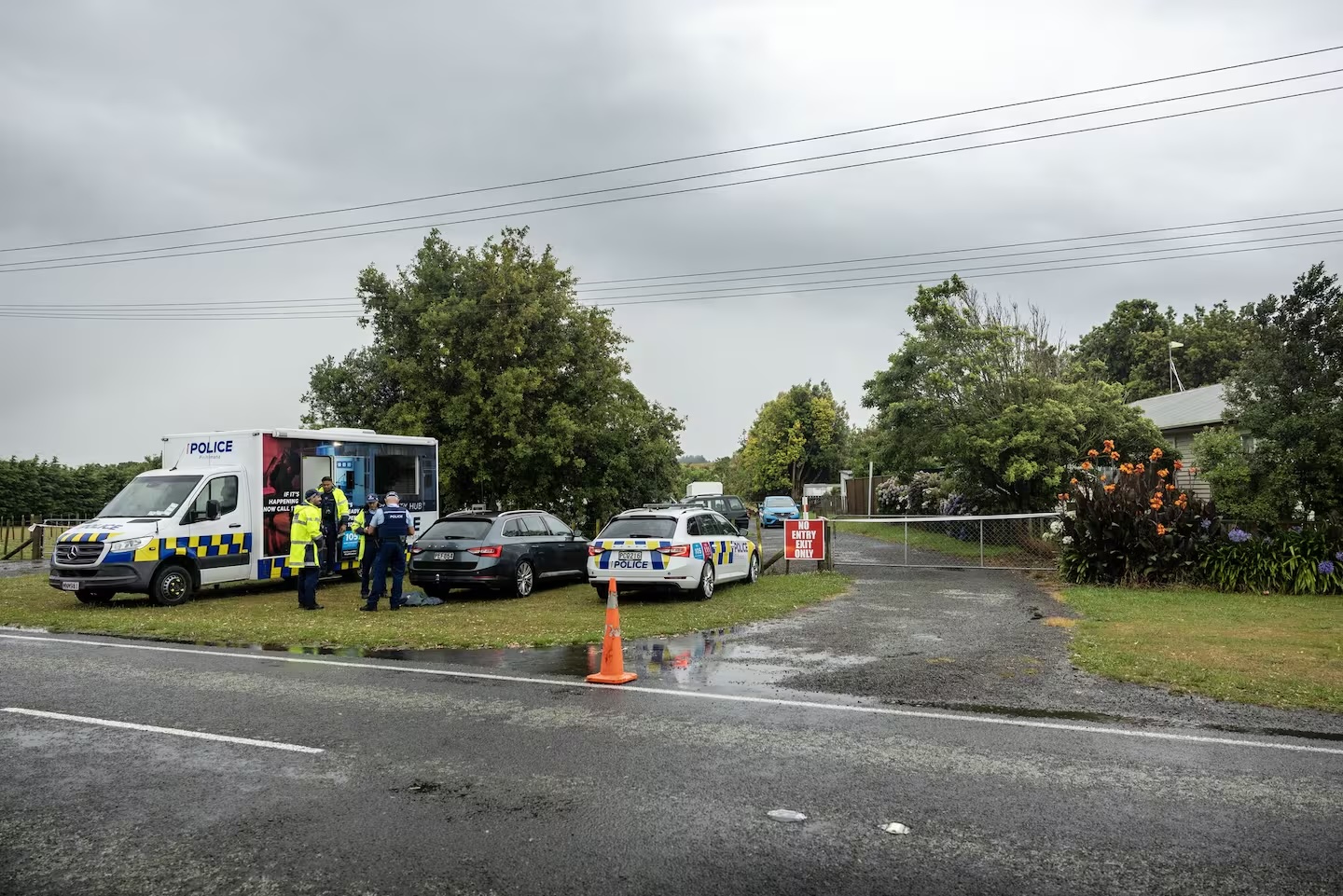 Police at a Waitārere Beach Rd property where Ben Timmins died of what police now say was a stab wound.