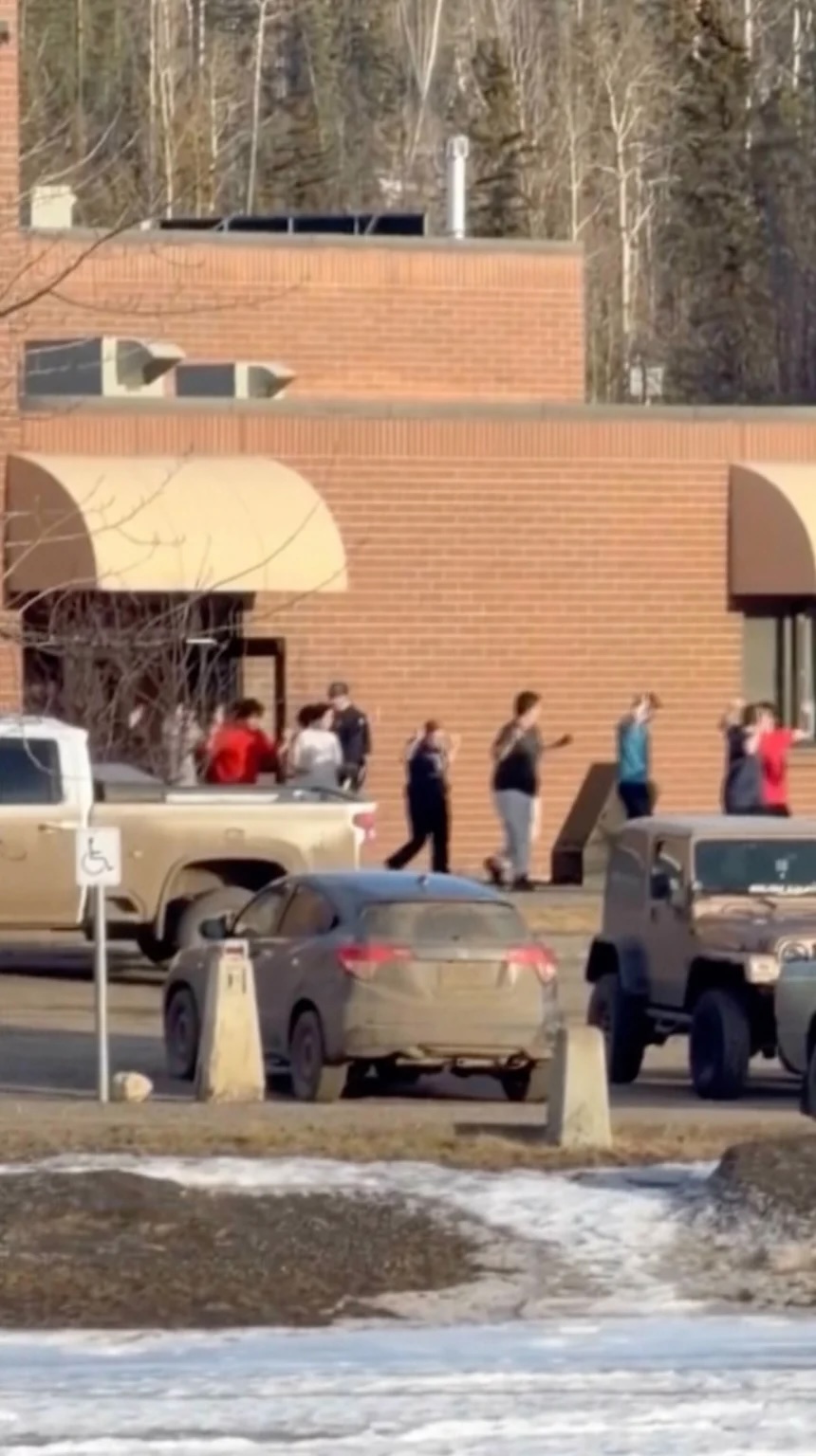 A grab from a video shows students exiting the Tumbler Ridge school after Tuesday's deadly shooting in British Columbia, Canada.