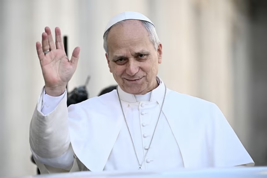 Pope Leo XIV waves to the crowd during the weekly general audience at St Peter's Square in The Vatican on February 18, 2026.