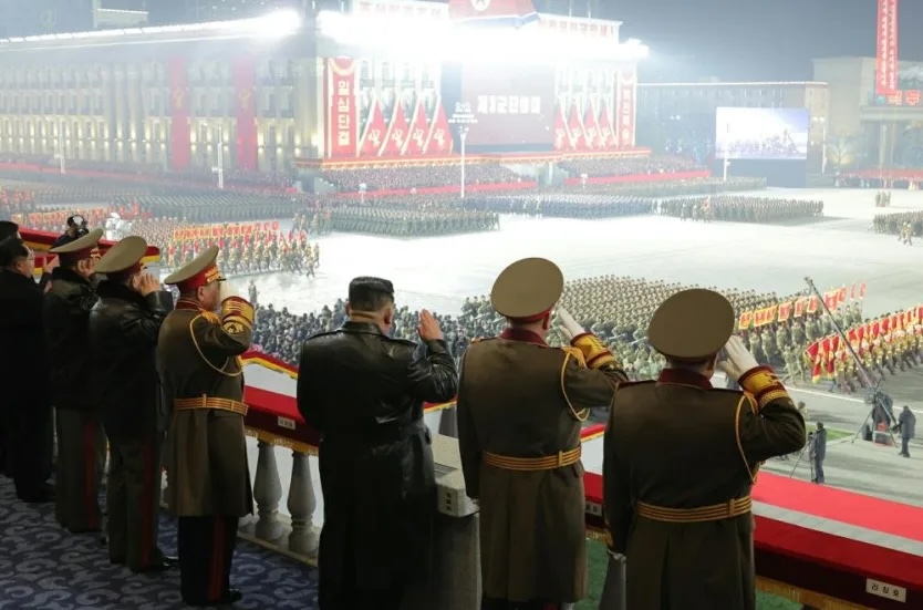 North Korean leader Kim Jong Un promised to strengthen his country’s nuclear weapons program on Wednesday, before presiding over a nighttime military parade.