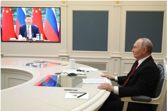 Russian President Vladimir Putin speaks with Chinese President Xi Jinping via videoconference at the Kremlin in Moscow.