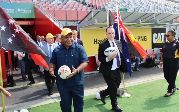 ARLC chairman Peter V'landys AM and NRL CEO Andrew Abdo, alongside PNG Prime Minister James Marape and Australian Minister for Pacific Island Affairs Pat Conroy.
