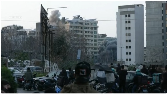 Smoke rises above central Beirut on Thursday evening.