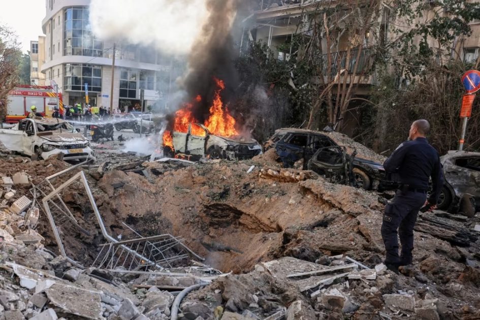 Emergency personnel respond at a site following Iranian missile barrages in central Israel, amid the US-Israel conflict with Iran, in Tel Aviv, Israel, March 24, 2026.