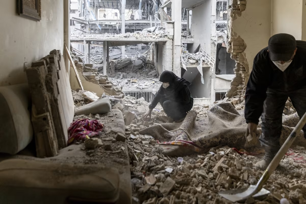 People sift through the rubble in a house in the Beryanak District that was damaged by missile attacks in Tehran, Iran, on March 15, 2026. Majid Saeedi:Getty Images.