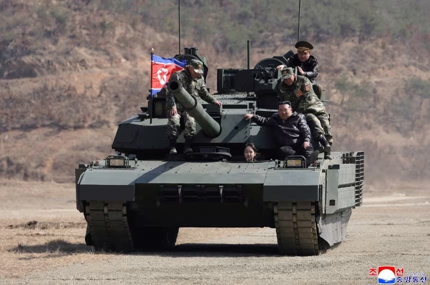 North Korean leader Kim Jong Un and his daughter Kim Ju Ae ride a tank during what North Korean state news agency KCNA reports is an offensive tactical drill involving a new type of tank, at a training base in Pyongyang, North Korea, March 19, 2026, in this picture released by North Korea's official Korean Central News Agency.