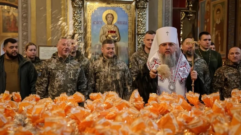 Metropolitan Epiphanius I, head of the Orthodox Church of Ukraine, sprinkles holy water to bless Easter cakes which are to be transferred to Ukrainian servicemen fighting on the frontline, during a ceremony at St Michael's Cathedral before Orthodox Easter, in Kyiv, Ukraine April 9, 2026.