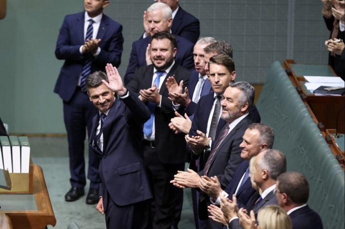 Angus Taylor was met with a standing ovation from his side of the chamber.