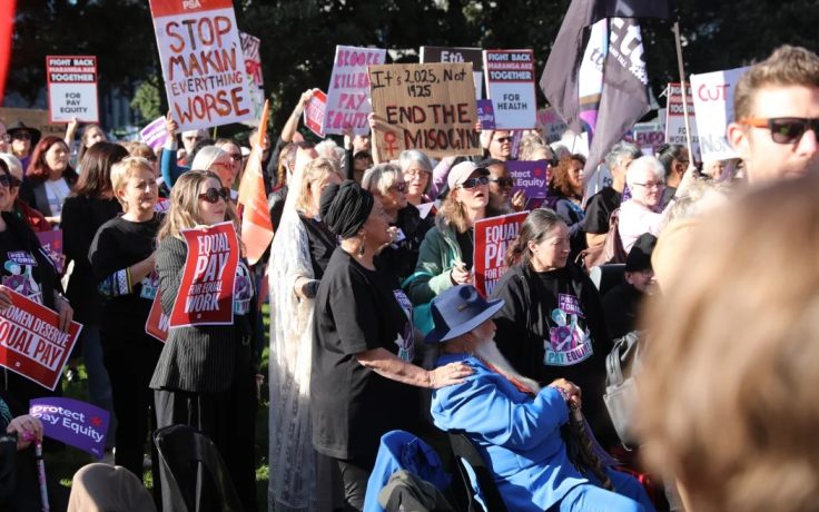 Pay equity protestors voice their opinions outside Parliament on Budget Day 2025.