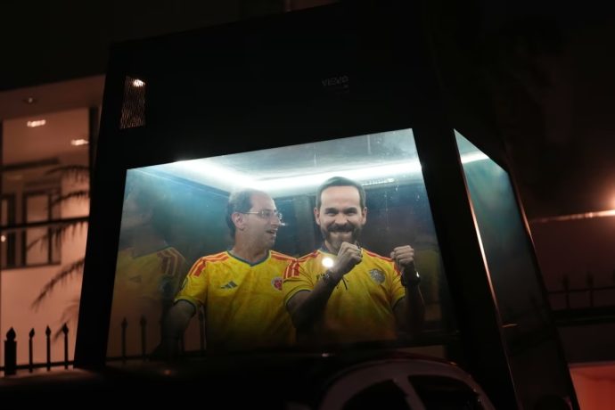 Presidential candidate Abelardo de la Espriella of the "Defenders of the Homeland" movement and his vice-presidential running mate, Jose Manuel Restrepo, ride in a bulletproof booth toward a celebration rally after election results showed him leading in Barranquilla, Colombia, Sunday, June 21, 2026.