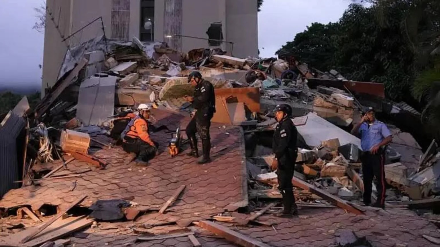 Emergency services searched through rubble following the tremors in Caracas.