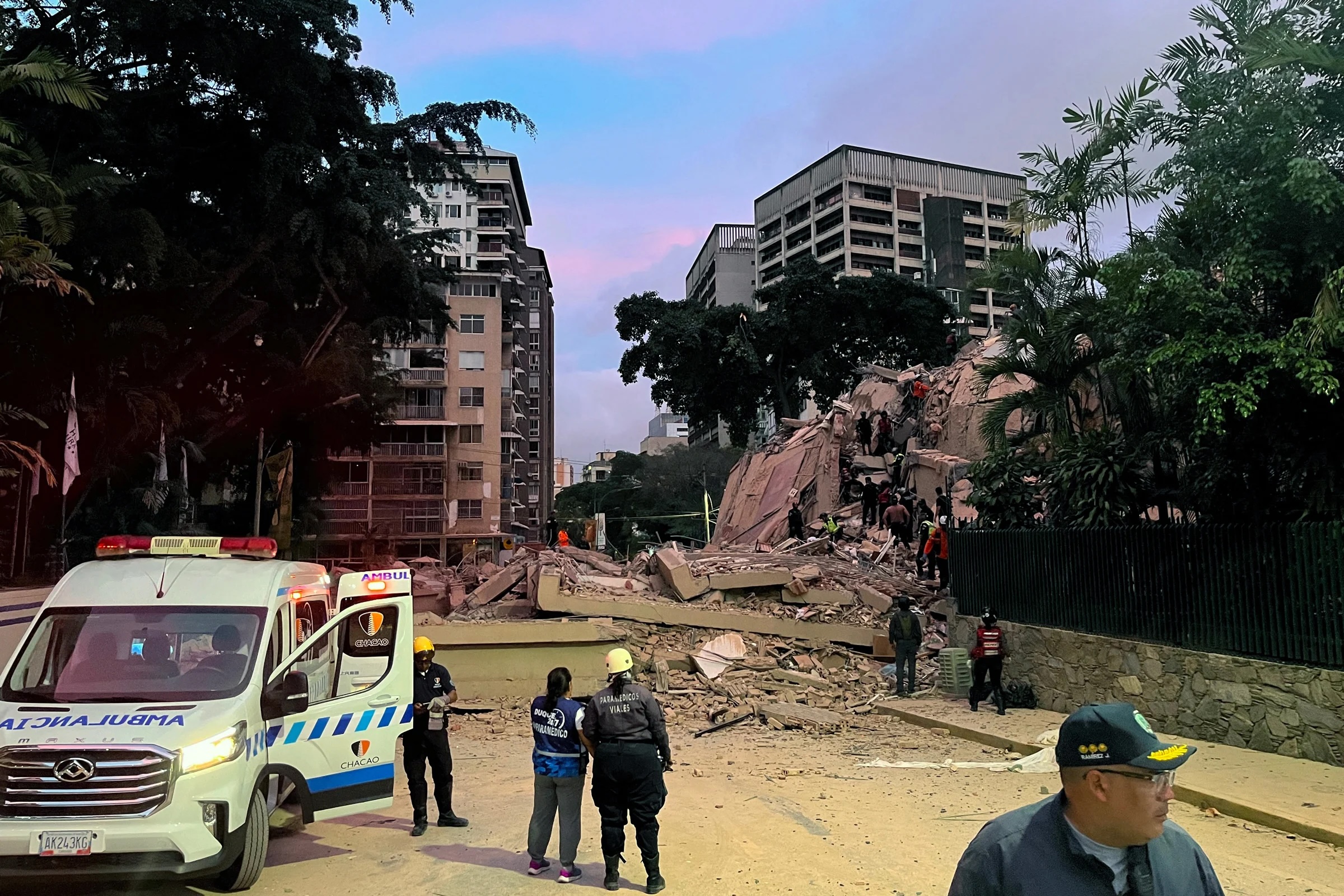 Rescuers search for victims in a collapsed building in Caracas following an earthquake on June 24, 2026.