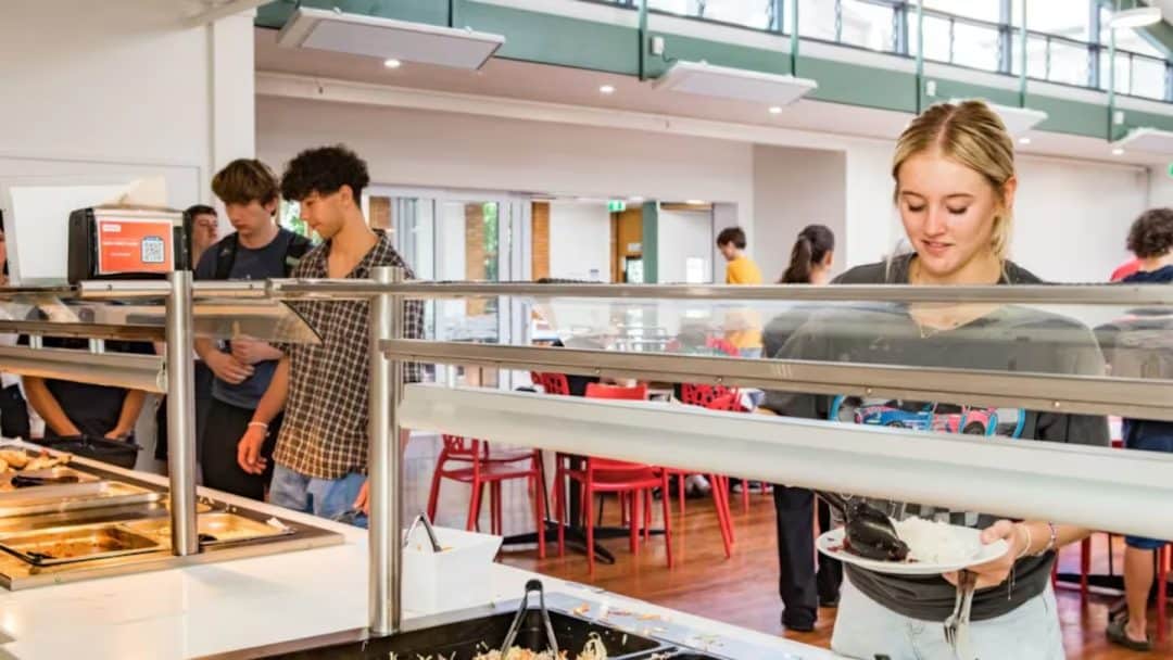Students in the dining hall at University Hall accommodation.