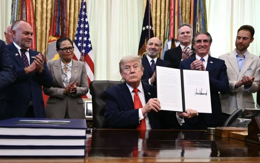 US President Donald Trump displays a proclamation on "returning American commercial fishing in the Pacific" in the Oval Office of the White House in Washington, DC, on 11 June 2026.