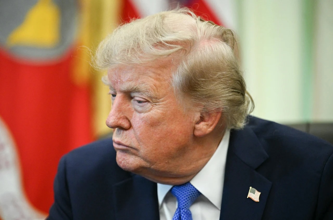 President Donald Trump looks on after signing executive orders in the Oval Office of the White House in Washington, DC, on Thursday, August 6.