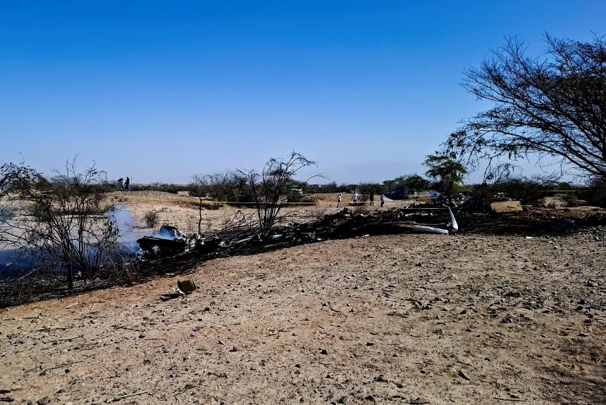 Authorities work where a small aircraft carrying tourists from Germany, Italy and Spain crashed near the Nazca Lines archaeological site, in Nazca, Peru, on August 1.