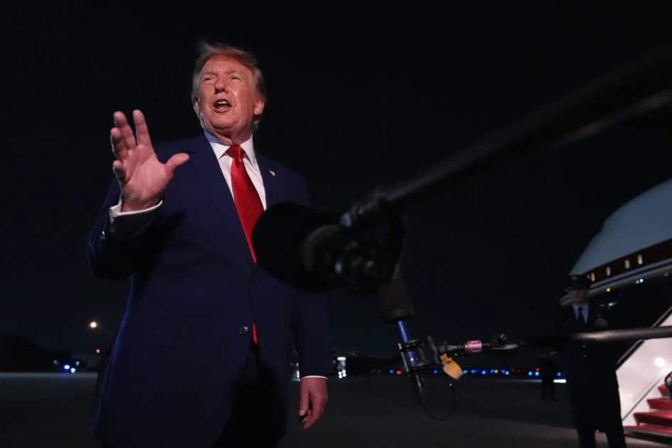 President Donald Trump talks to reporters after arriving on Air Force One Tuesday, August 11, at Joint Base Andrews, Maryland.