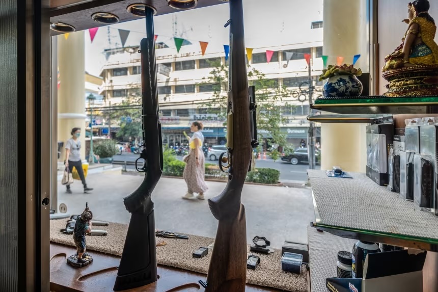 Rifles are seen inside a firearm shop in Bangkok, Thailand.