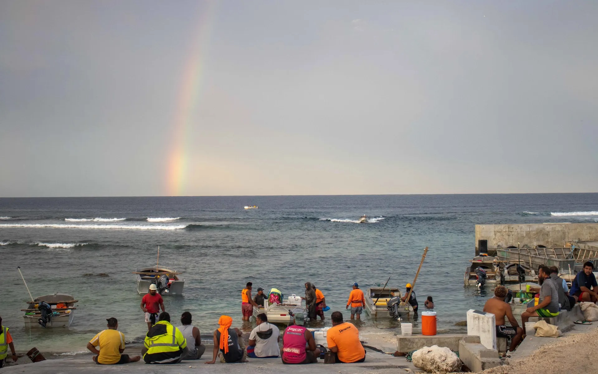 Waiting for boats to bring in their catches.